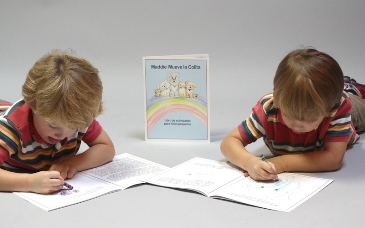 Boys working in their Spanish Tail Wag books. Photo by Sonya Paschedag.